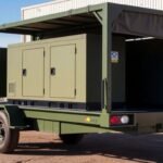 Military generator trailer parked outdoors.